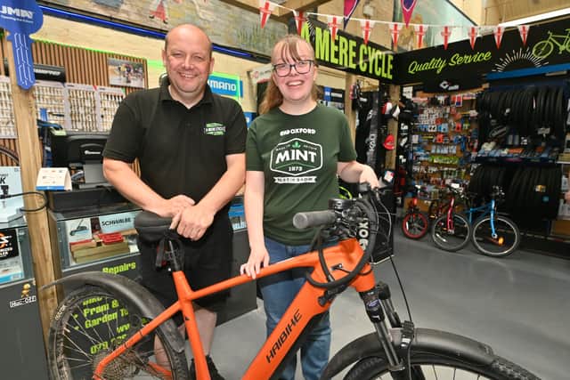Ellesmere Market Hall that has had new investment , new people running it, new traders, and is now buzzing.   Mere Cycles and from them father and daughter: Rod Evans and Louise Evans.