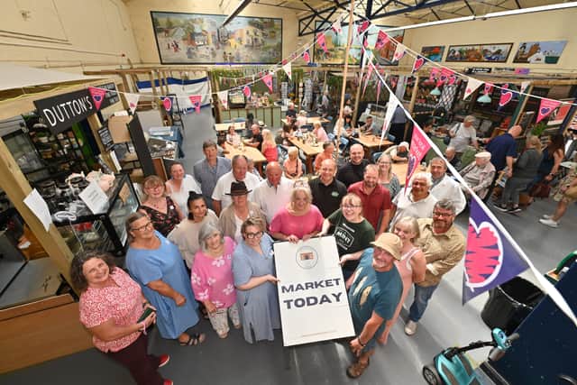Ellesmere Market Hall that has had new investment , new people running it, new traders, and is now buzzing.   Traders group pic.
