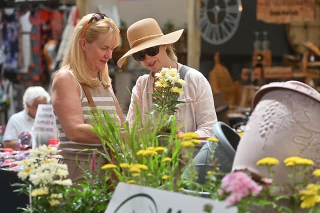 Ellesmere Market Hall that has had new investment , new people running it, new traders, and is now buzzing.