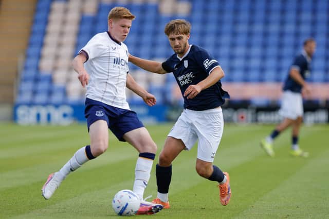 Isaac England in action for Shrewsbury Town against Everton Under-21s
