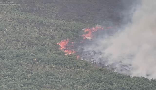 Dramatic drone footage shows the huge scale of a wildfire covering nearly 200 acres in Wales.