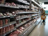 A person browses food in a supermarket