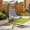 The dark grey hanging egg chair stands 202cm tall and comes with removable washable cushions
