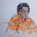 A court sketch of D4vd in orange prison overalls