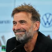 Jurgen Klopp smiles at a press conference