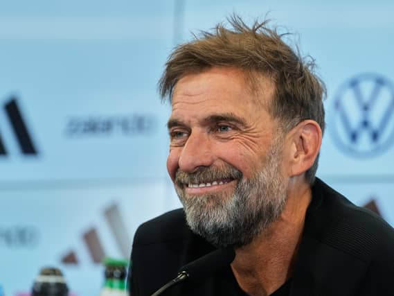 Jurgen Klopp smiles at a press conference