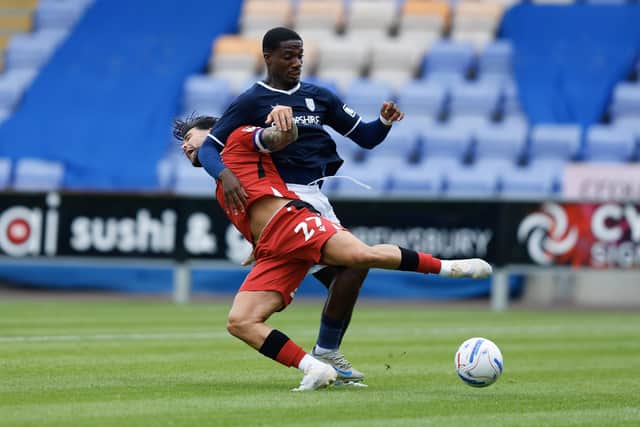 Joe Gbode battled hard for Shrewsbury Town against West Brom