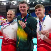 Ollie Morgan, right, on the 200m backstroke podium with Luke Greenbank and Pieter Coetze