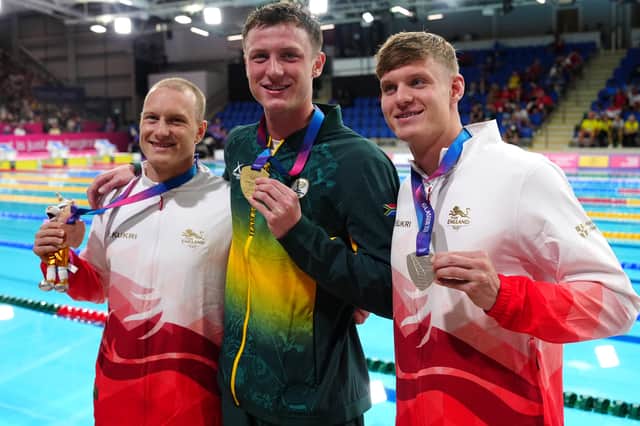 Ollie Morgan, right, on the 200m backstroke podium with Luke Greenbank and Pieter Coetze
