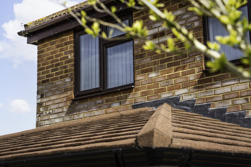 A modern home extension featuring double-glazed window installations and roofline improvements by Reliant Windows.