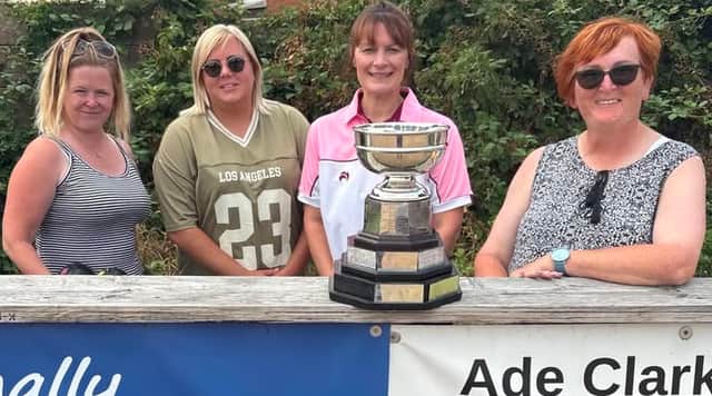 The prize at stake – County Doubles winners Cheryl Caswell & Sian Skelton and (right) finalists Sarah Weaver & Louise Cotton admire the trophy