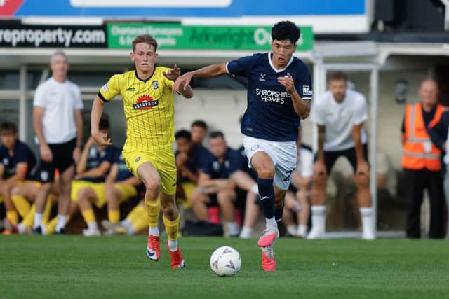 Isaac Lee charges forward from the defensive line for Shrewsbury Town