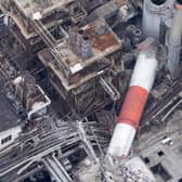 This aerial image shows a chimney collapsed at the Nippon Paper Industries' Yatsushiro factory