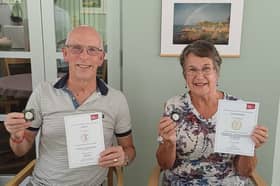 Jeff Smith OBE and Pauline Stansfield proudly display their awards