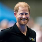 The Duke of Sussex smiles at the camera