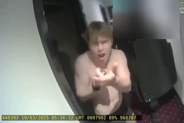Johannes Natland, 19, pretending to shoot an armed officer during his arrest on March 19 2025 (Counter Terrorism Policing/PA)
