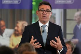 Prime Minister Andy Burnham delivers a speech during a visit to a care home in north London