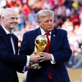 FIFA president Gianni Infantino and US president Donald Trump with the World Cup trophy