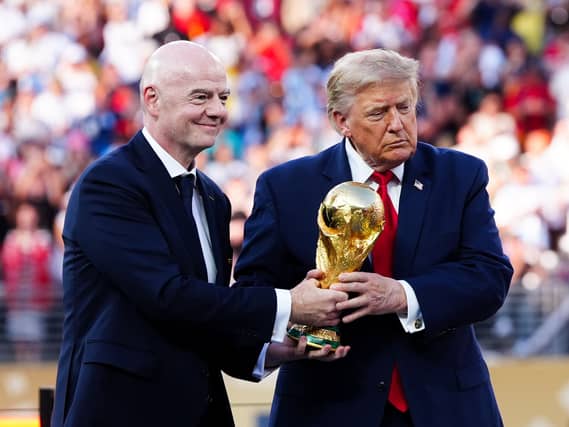 FIFA president Gianni Infantino and US president Donald Trump with the World Cup trophy