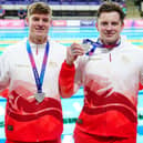 Edward Mildred, Oliver Morgan, Adam Ramsey-Peaty, and Jacob Mills of England celebrate with their silver medals after the Men's 4 X 100m Medley Relay Final at Tollcross International Swimming Centre during day six of the 2026 Commonwealth Games in Glasgow