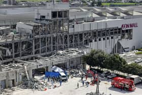 In this aerial image taken with a drone, responders work outside AEON Mall Kumamoto
