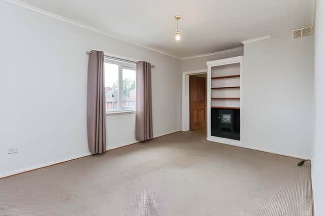 The spacious lounge, complete with a feature fireplace, provides a welcoming setting to relax or entertain.