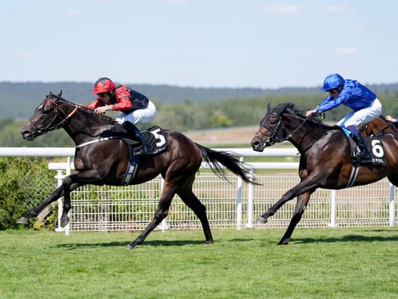 Shayem (left) on his way to victory at Goodwood