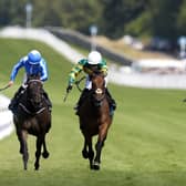 Goodie Two Shoes (centre) gets the better of Santorini Star (left)