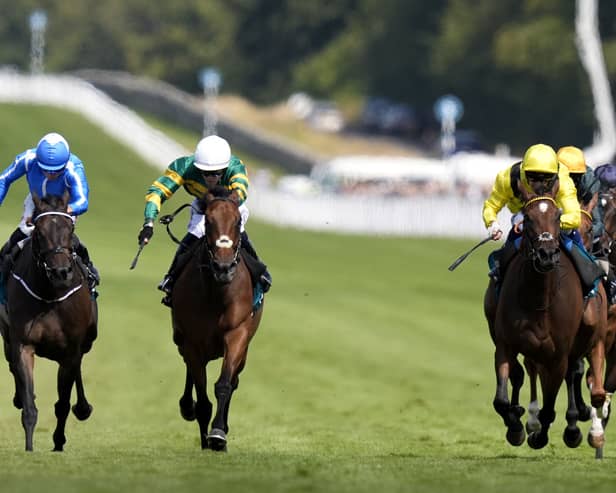 Goodie Two Shoes (centre) gets the better of Santorini Star (left)