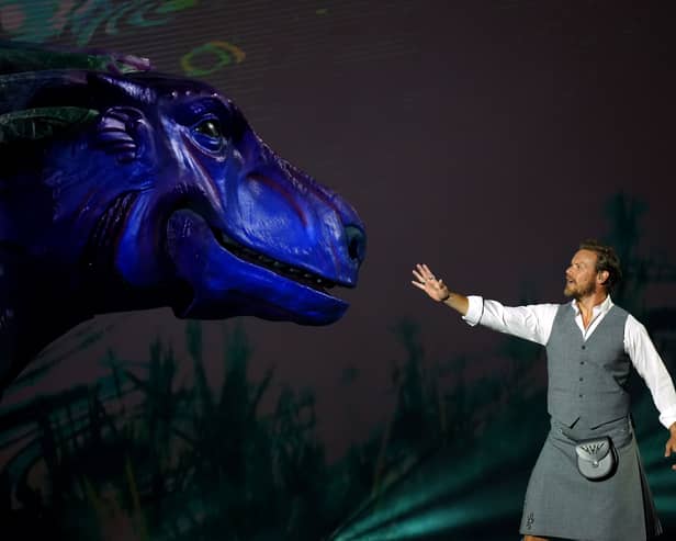 Sam Heughan touching Nessie