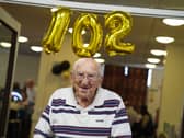 Monty Goldstein with a 102nd birthday balloon