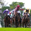 Daniel King (third right) riding Putapoundinthejar adds the Galway Hurdle to his Plate success