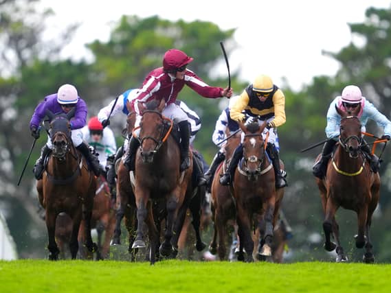 Daniel King (third right) riding Putapoundinthejar adds the Galway Hurdle to his Plate success
