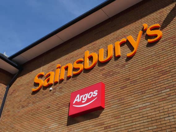 Sainsbury's and Argos logos outside a Sainsbury's supermarket.