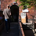 A man walking into a polling station