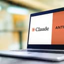 A laptop showing the Claude and anthropic logos