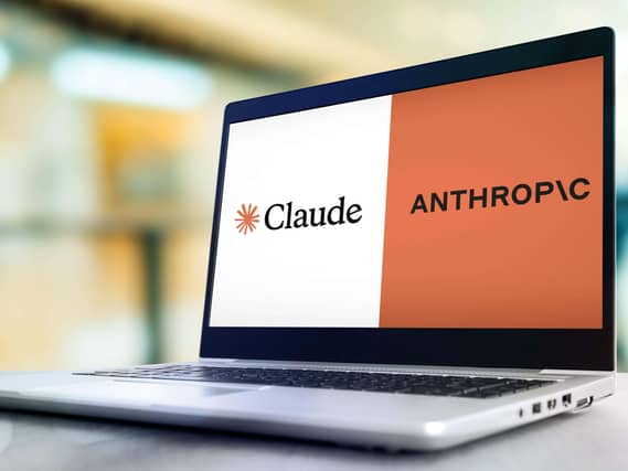 A laptop showing the Claude and anthropic logos