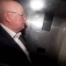 Peter Murrell in the back of a prison van