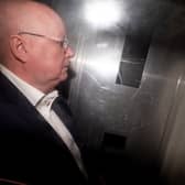Peter Murrell in the back of a prison van