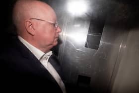 Peter Murrell in the back of a prison van