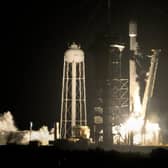 A SpaceX Falcon 9 rocket lifts off from pad 39A with a payload of a pair of lunar landers at the Kennedy Space Centre in Cape Canaveral, Florida