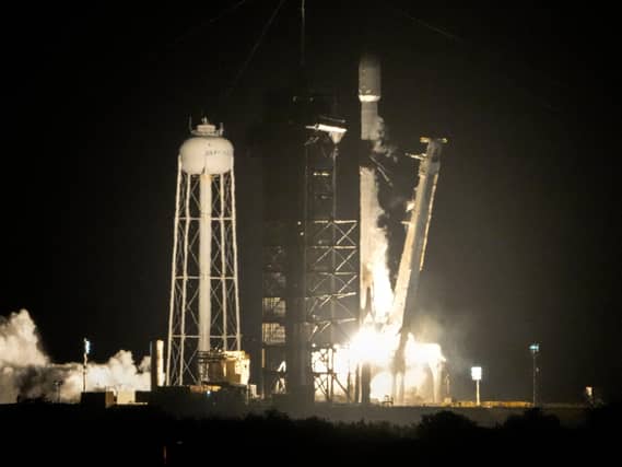 A SpaceX Falcon 9 rocket lifts off from pad 39A with a payload of a pair of lunar landers at the Kennedy Space Centre in Cape Canaveral, Florida