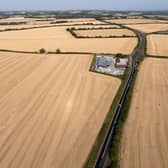 Aerial view of dry, harvested fields in the sunshine