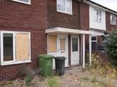 House with boarded windows