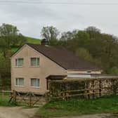 Plans to remove occupancy restrictions from a farmhouse near Knighton will be before Powys council's Planning committee for a decision. From Google Streetview.