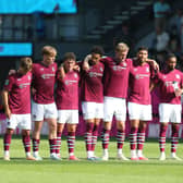Burnley players line up during a penalty shoot-out