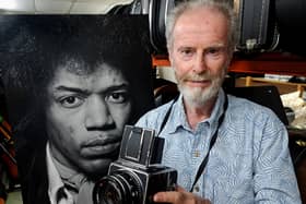 Gered Mankowitz with his photograph of Jimi Hendrix