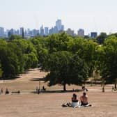 People sitting in a parched park