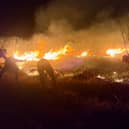 Firefighters attempt to extinguish a wildfire that razes through Mount Bromo National Park in Probolinggo