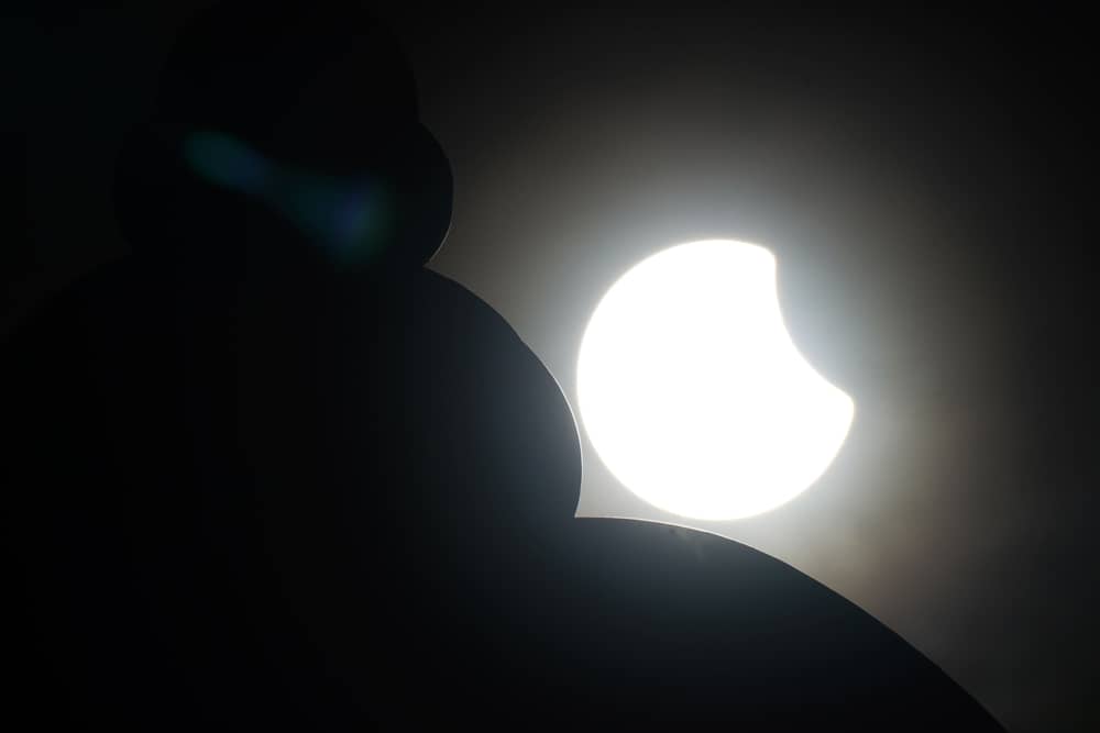 A partial solar eclipse is seen behind the domed roof of the Greenwich foot tunnel north in Island Gardens, Isle of Dogs, east London